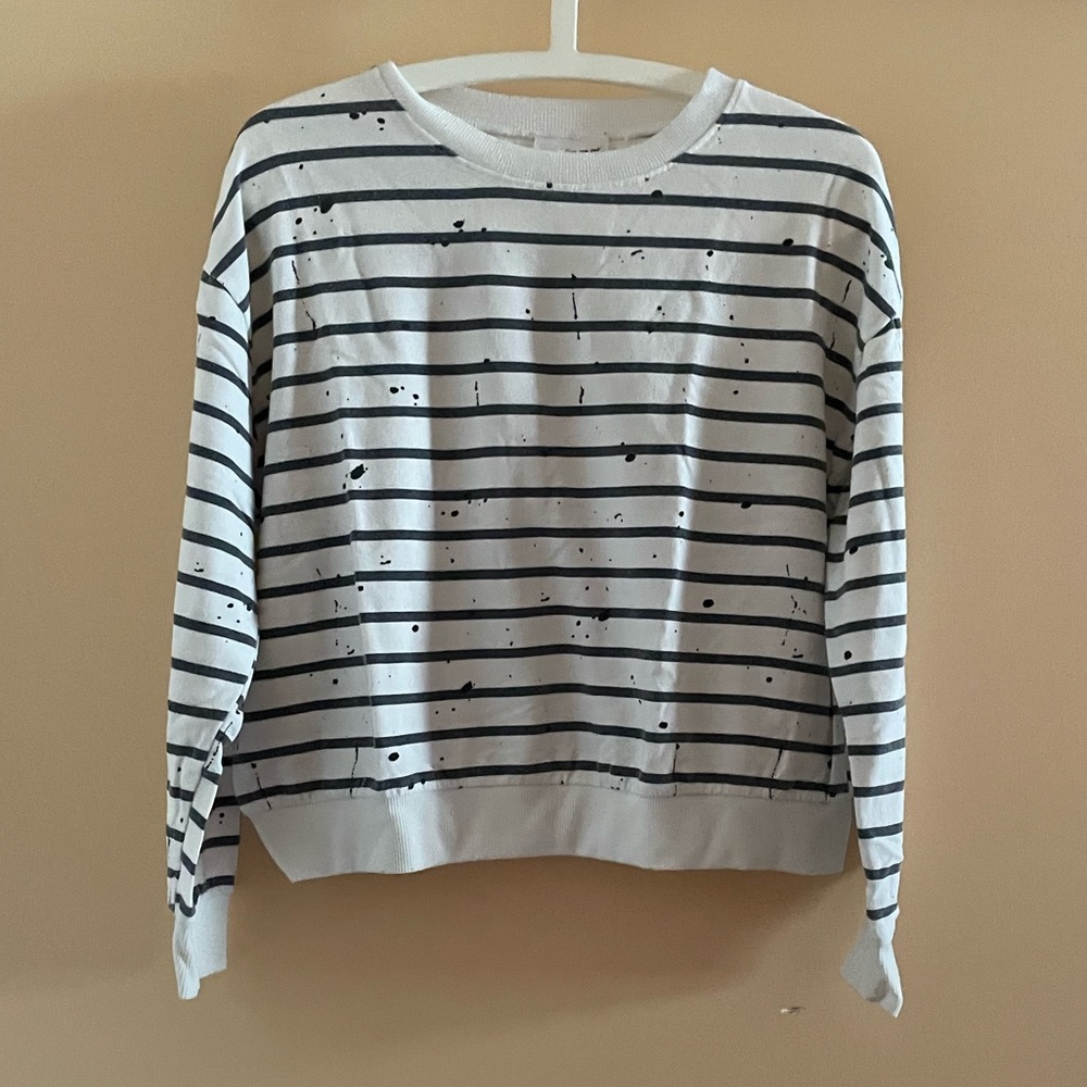 Black and white stripes pattern sweatshirt with black paint splatter